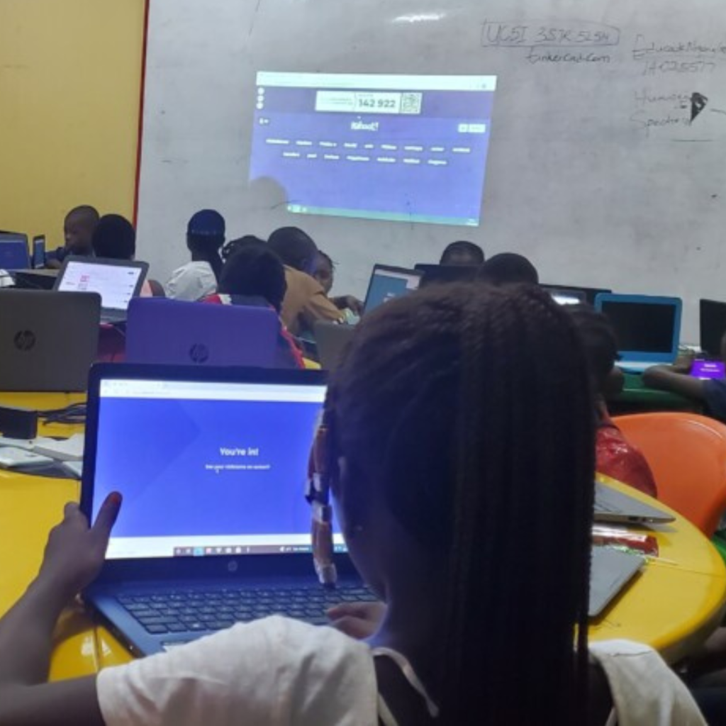 A group of young Nigerians participating in a digital literacy training session.