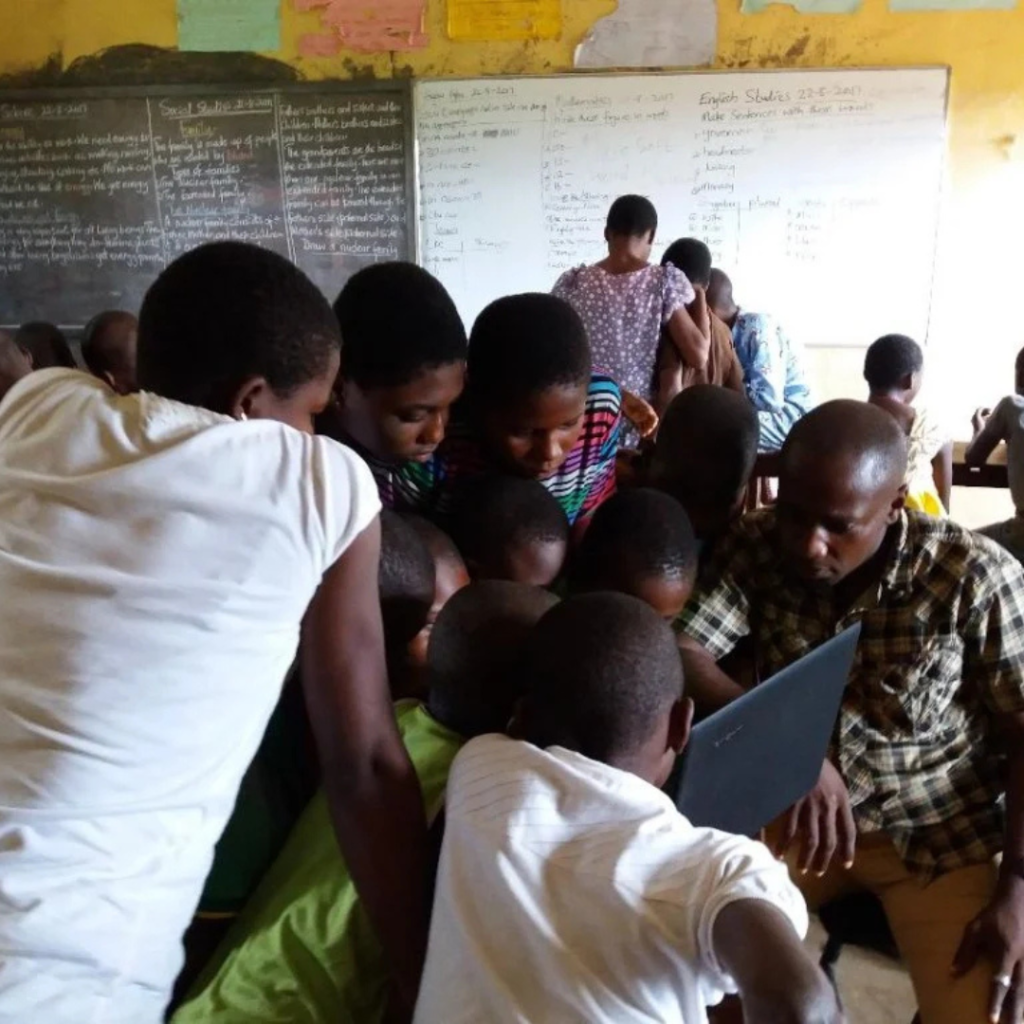 A rural Nigerian village with young people struggling to access digital tools.