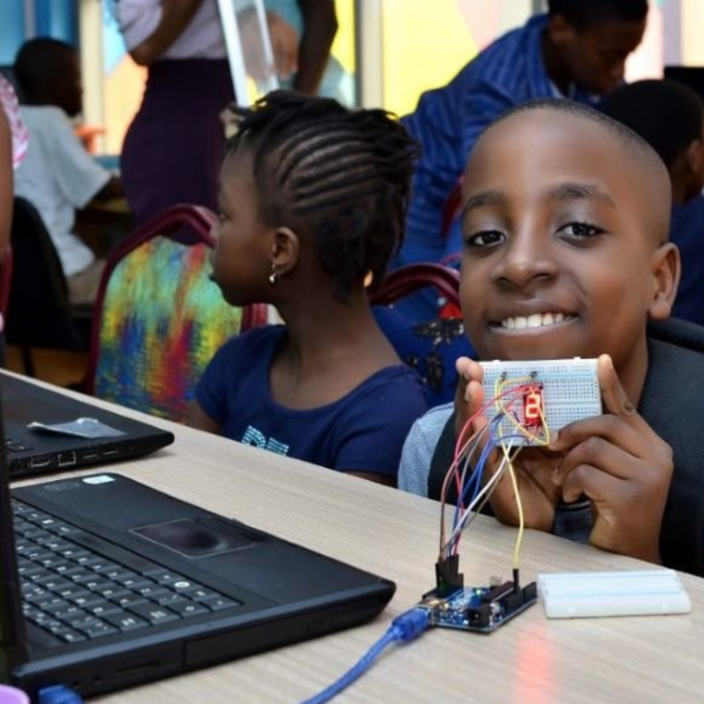 A Nigerian classroom with young adults learning computer skills